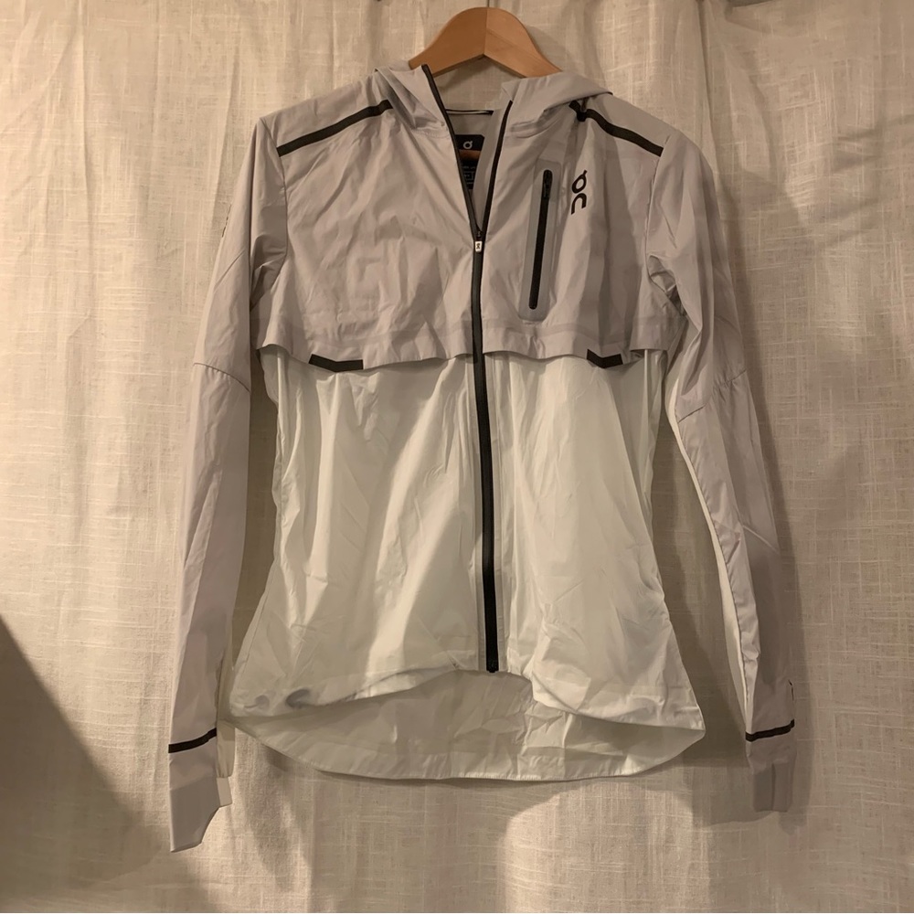 On Running Light Gray and White Hooded Utility Running Jacket